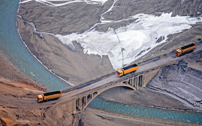 Miner's Truck Rolling on a Bridge